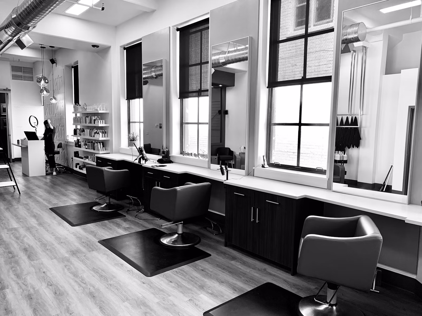 Bright, modern salon interior with styling chairs and mirrors