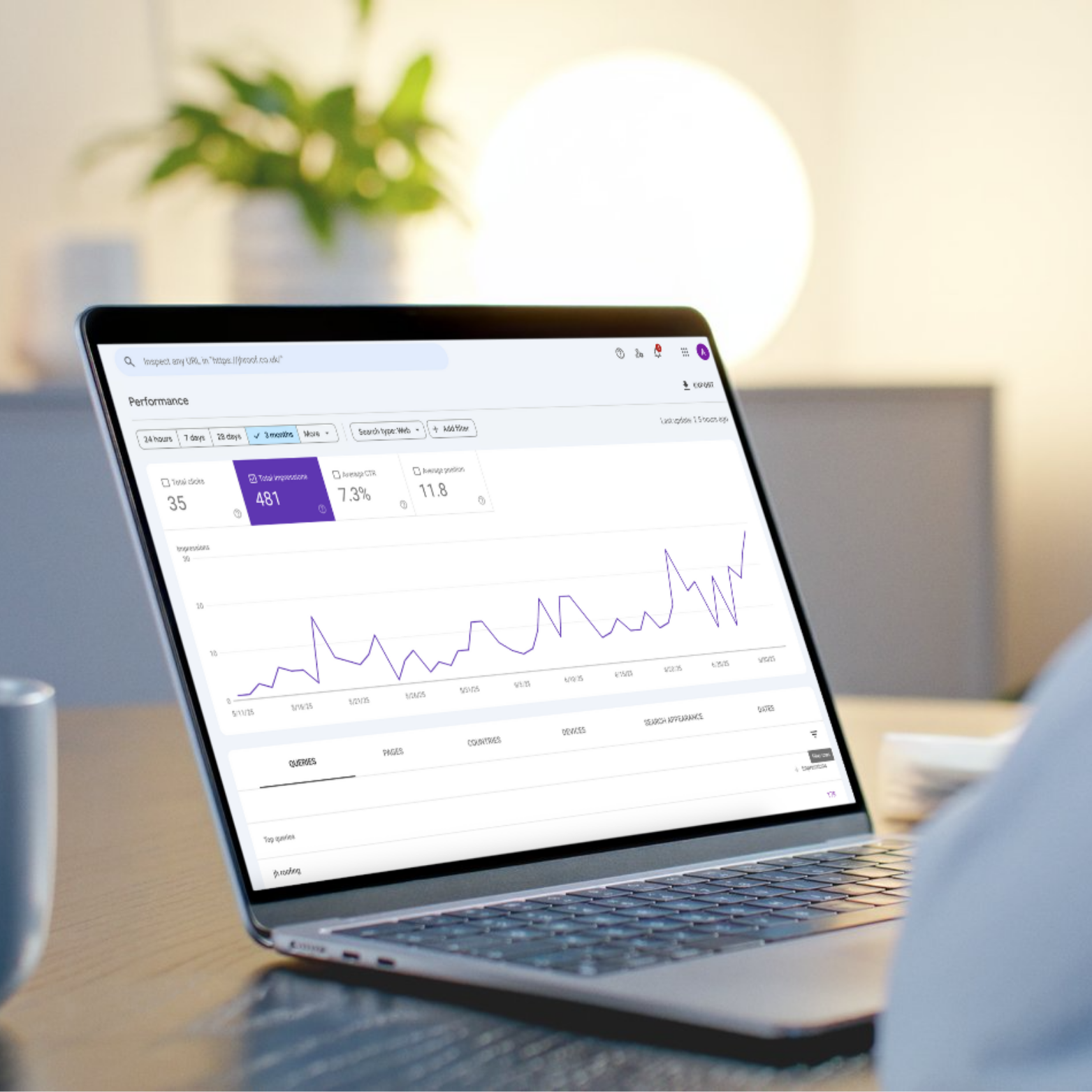 Person analysing website performance data on a laptop using Google Search Console